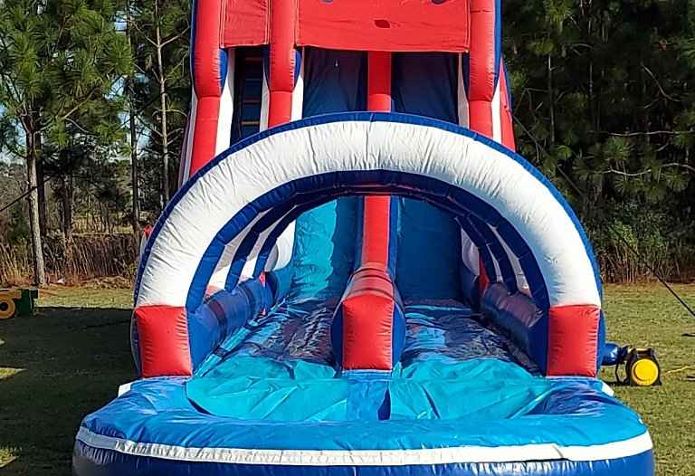 24 ft red, white and blue dual lane with attached slip slide 
